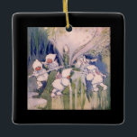 Adorno De Cerámica Snow Faeries Making Snow<br><div class="desc">vintage fairylands painting of snow fairies making snow dressed in white fluffy hooded coats, pretty pink wings and fur lined trousers working and pushing snow covers sticks around a snow mill to churn and make snow. vintage illustrative watercolor fairyland painting of fairies on top of a mountain manufacturing snow by...</div>