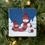 Adorno De Cerámica Snowman Knitting Christmas Scarf<br><div class="desc">Cartoon illustration of two adorable snowmen dressed in knitted hats and scarves. The big snowman is knitting an oversized scarf for the little one. The scarf is already wrapped several times around the cute little snowman.</div>