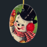 Adorno De Cerámica Snowman vintage con pájaro rojo<br><div class="desc">Hombre de nieve retro con sombrero superior y bufanda sosteniendo un pequeño pájaro rojo.</div>