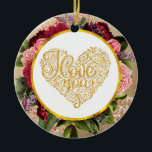 Adorno De Cerámica Te amo el corazón dorado con marco floral<br><div class="desc">Un adorno con un corazón dorado de lujo. Giros decorativos y formas con las palabras "I Love You" escritas en lujosas letras. Rodeado por un marco circular con un borde de Relieve metalizado de oro falso. Detrás del marco de círculo hay algunos florales de bonito en rojo, rosa y morado...</div>