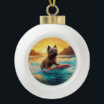 Adorno De Cerámica Tipo Bola Pintura de Cairn Terrier Beach Surfing<br><div class="desc">Sumérgete en el mundo lúdico de la aventura canina con esta pintura cautivadora. Un perro animado lleva a las olas, subiendo con habilidad al surf en una playa con sol. El vibrante arte captura bellamente la esencia de la emoción en la playa mientras el perro recorre sin miedo las olas,...</div>