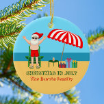 Adorno De Cerámica Verano de julio: Santa Claus Cute Beach<br><div class="desc">Este adorable Navidad personalizado en julio es un regalo fiesta perfecto para el verano, para una reunión en la playa o en la piscina. Hacerlo un divertido espectáculo con la temática del polo norte con Santa Claus en sus baúles de natación al lado de un paraguas de playa de rayas...</div>
