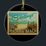 Adorno De Cerámica Viaje de Madeira Beach<br><div class="desc">Este diseño de postal antiguo de Greetings From Madeira Beach incluye una playa de arena con un hermoso agua de mar turquesa y sobre el mar,  un cielo azul con nubes blancas onduladas. En estilo de viajes vintage.</div>