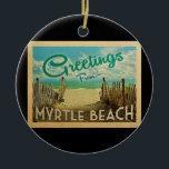 Adorno De Cerámica Viaje de Myrtle Beach<br><div class="desc">El diseño de esta postal antigua de Greetings From Myrtle Beach presenta una playa de arena con un hermoso agua turquesa del océano y sobre el mar,  un cielo azul con nubes blancas onduladas. En estilo de viajes vintage.</div>