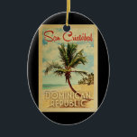 Adorno De Cerámica Viaje de San Cristobal Palm Tree Vintage<br><div class="desc">Un moderno San Cristóbal República Dominicana de mediados de siglo,  de estilo poster vintage. Cuenta con una palmera curva en una playa de arena con océano bajo un cielo nublado azul.</div>