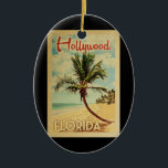 Adorno De Cerámica Viaje de vintage de Hollywood Palm Tree<br><div class="desc">Una estampada de arte de Hollywood Florida,  de estilo poster de viajes vintage,  de estilo moderno y único retro de mediados de siglo. Cuenta con una palmera curvada en una playa de arena con el océano bajo un cielo azul turbio.</div>