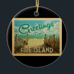 Adorno De Cerámica Viaje Vintage de Fire Island Beach<br><div class="desc">El diseño de esta postal antigua de Greetings From Fire Island incluye una playa de arena con un hermoso agua turquesa del océano y sobre el mar,  un cielo azul con nubes blancas onduladas. En estilo de viajes vintage.</div>