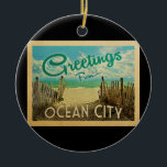 Adorno De Cerámica Viaje Vintage de Ocean City Beach<br><div class="desc">El diseño de esta postal antigua de Greetings From Ocean City incluye una playa de arena con un hermoso agua turquesa del océano y sobre el mar,  un cielo azul con nubes blancas onduladas. En estilo de viajes vintage.</div>
