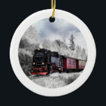 Adorno De Cerámica Vintage Train Winter Christmas Scene<br><div class="desc">Ornament with a photograph of a snowy winter landscape with snow-covered pine trees. A red,  gold and black old-fashioned train travelling through the wilderness. Conjures up thoughts of coming home for Christmas.</div>