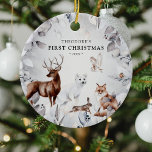 Adorno De Cerámica Watercolor Winter Woodland Wildlife Primer Navidad<br><div class="desc">Guarda el adorno de "Primera Navidad". Nuestro diseño cuenta con un marco foliage botánico acuarela con acuarelas realistas (ciervo,  zorro,  liebre,  rastrojo de nieve,  búho y ladin),  nombre y año.</div>
