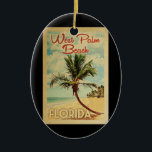 Adorno De Cerámica West Palm Beach Palm Tree Vintage Travel<br><div class="desc">Un diseño de arte de West Palm Beach Florida,  retro y exclusivo,  de estilo poster de viajes vintage. Cuenta con una palmera curvada en una playa de arena con el océano bajo un cielo azul turbio.</div>