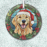 Adorno De Cristal Holly Wreath Golden Retriever Dog Navidades<br><div class="desc">Aquí hay un adorno de cristal de bonito con una temática de vidrio manchado, con un feliz Golden Retriever. El perro está usando un gorra rojo y blanco de Santa Claus, con un fondo azul del cielo. La imagen está enmarcada en una flor verde bonito y en una corona roja...</div>