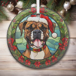 Adorno De Cristal Navidades Poinsettia Santa Hat Boxer Dog<br><div class="desc">Aquí hay un adorno de cristal de bonito con una temática de vidrio teñido, con un perro Boxer de color marrón y blanco. El perro lleva puesto un sombrero y collar de Santa Claus rojo, con un fondo azul verde de montaña y cielo. La imagen está enmarcada en un hueco...</div>