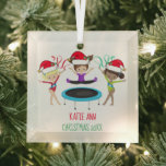 Adorno De Cristal Niños Personalizados de gimnasia educada Navidades<br><div class="desc">Este hermoso adorno navideño de gimnasia personalizado incluye a 3 lindos chicas de gimnastas con sombreros de Papá Noel y llevando una pose con cintas con el mensaje de su bonito en rojo y verde. La rubia sostiene una cinta roja, la morena salta sobre un trampolín, y el chica afroamericano...</div>