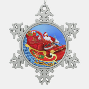 ADORNO DE PELTRE TIPO COPO DE NIEVE AQUÍ VIENE SANTA CLAUS