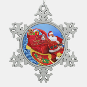 ADORNO DE PELTRE TIPO COPO DE NIEVE AQUÍ VIENE SANTA CLAUS