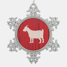 El panel rojo de madera del granero de la cabra