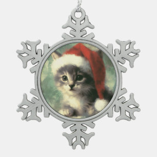 Adorno De Peltre Tipo Copo De Nieve Gatito en un ornamento enmarcado por un copo de ni