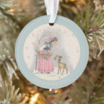 Adorno Dulce Chica de la escena navideña vintage Fawn<br><div class="desc">Este adorno presenta una dulce escena de Navidades de una niña con disfraz rosa vintage reuniendo bromas huecas con la ayuda de un lindo peón. Personalizar con el año o el texto de tu elección en letras decorativas beige sobre el borde azul.</div>