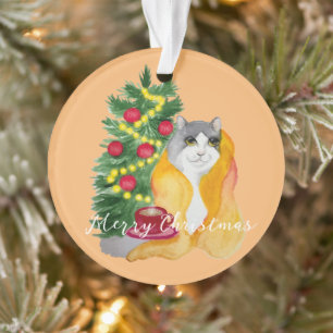 Adorno Gato lindo bajo una manta acogedora con una taza d