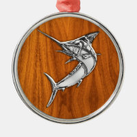 Aguja del cromo en la madera de la teca