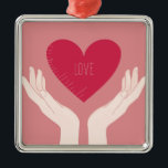 Adorno Metálico El corazón rojo ama al El día de San Valentín romá<br><div class="desc">diseño romántico de un corazón rosa brillante con la palabra amor en el medio y dos manos sosteniendo el corazón contra un fondo rosa rubor. Este bonito diseño elegante de chicas es perfecto para el día de San Valentín o cualquier otra ocasión romántica.</div>