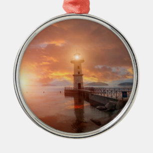 Adorno Metálico Faro en la puesta del sol