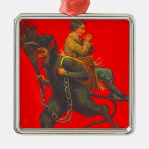 Adorno Metálico Niño Rojo Krampus secuestrando niño orando