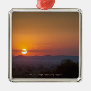 Adorno Metálico Puesta del sol sobre el paisaje africano