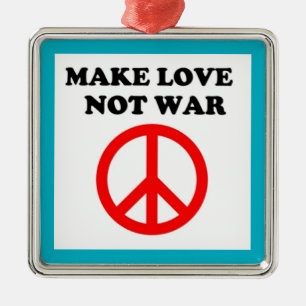 ADORNO METÁLICO SIGNO DE PAZ "HACER EL AMOR NO LA GUERRA"
