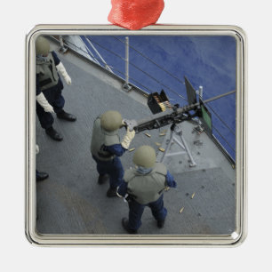 Adorno Metálico Un marinero de los E.E.U.U. enciende 50 un calibre