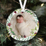 Adorno Primera fiesta verde navideña Wreath Baby Photo<br><div class="desc">Este elegante adorno de dos caras de fotos de vacaciones contiene una foto de un recién nacido de su bebé enmarcado por una floral cortina de vegetación de las vacaciones de acuarela. El dorso del adorno incluye la frase "Primera Navidad" con texto personalizado que puede personalizarse con el nombre completo...</div>