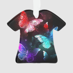 Adorno Tres mariposas brillantes en el fondo nocturno