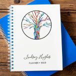 Agenda Árbol personalizado de la vida<br><div class="desc">Planificador de árbol personalizado de la vida 2022. Este elegante Planner está decorado con un diseño de un árbol de la vida en colores arcoiris. Personalizable fácil con tu nombre y año. Porque creamos nuestra propia obra de arte no encontrarás esta imagen exacta de otros diseñadores.</div>