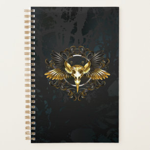 Agenda Calavera de pájaro dorado sobre fondo negro