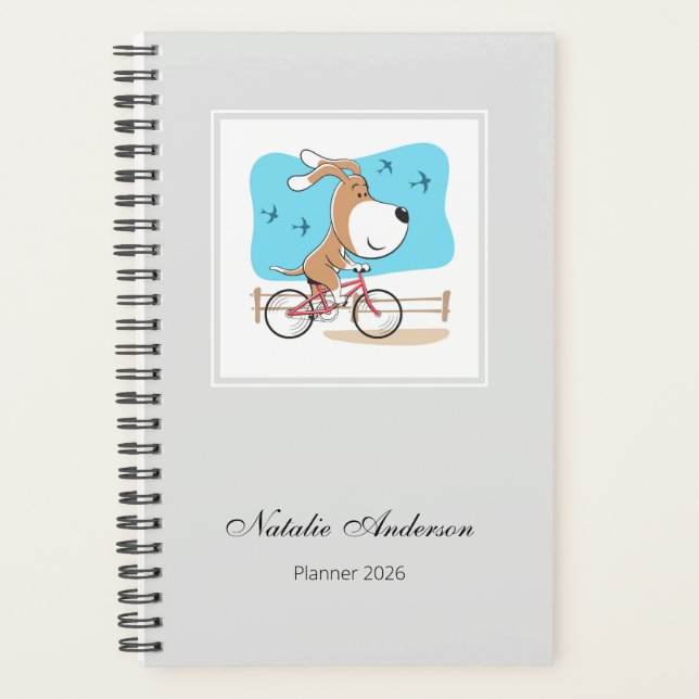 Agenda Cartoon Cute Dog Puppy Bicycle Riding Bike 2026 (Anverso)