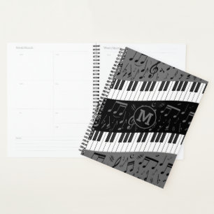 Agenda Claves de piano en curva monogramadas y notas musi