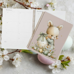 Agenda Conejo bebé lindo en pijama con un huevo de Pascua