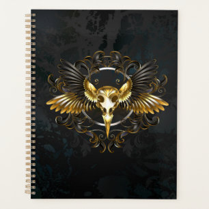 Agenda Cráneo de pájaro dorado sobre fondo negro