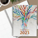Agenda Custom Name 2023<br><div class="desc">This unique Planner is decorated with a brightly coloured mosaic tree. Customize it with your name and year. To edit further use the Design Tool to change the font, font size, or color. Because we create our artwork you won't find this exact image from other designers. Original Mosaic © Michele...</div>