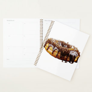 Agenda Donut decadente de SlipperyJoe's cubierto con un g