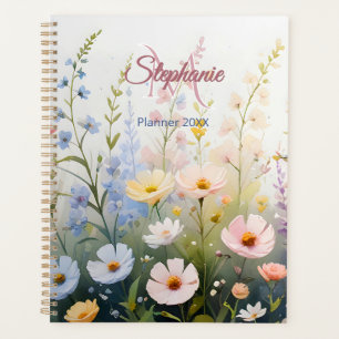 Agenda El prado de flores silvestres en un monograma con 