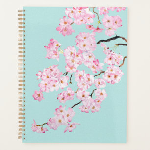 Agenda Flor de cerezo rosa delgada en un fondo azul