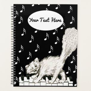 Agenda Gato blanco Winking en Piano Keys Music Note
