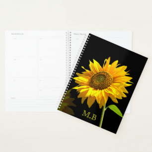 Agenda Girasol brillante en fondo negro