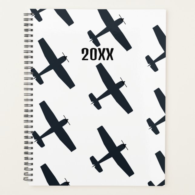 Agenda Guay, avión simple volando, negro y blanco (Anverso)