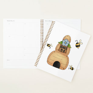 Agenda La colmena de miel con flores azules y abejas