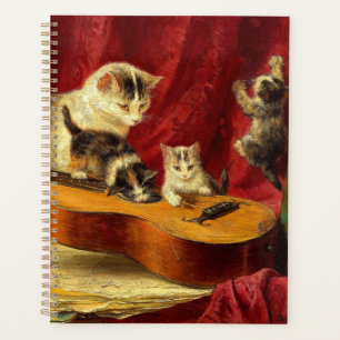 Agenda Madre gata y gatitos jugando con guitarra