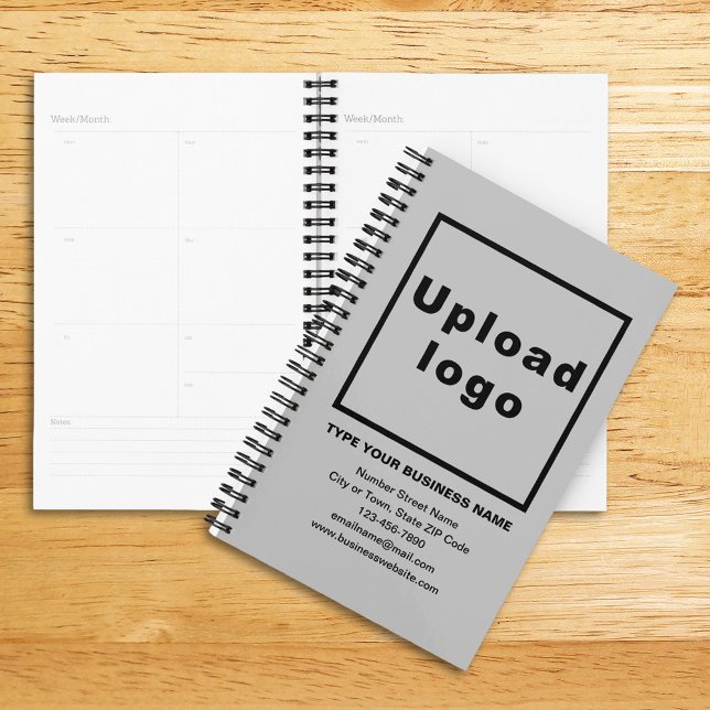 Agenda Marca comercial sobre la cubierta gris del planifi (Planner with gray cover and your business brand)