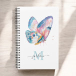 Agenda Mariposa color agua colorida con monograma<br><div class="desc">Una hermosa mariposa acuarela en tonos vivos de azul, agua, rosa, naranja y blanco recuerda a la belleza de la naturaleza que encontramos en estas criaturas magníficas. Se utiliza una plantilla de texto moderna para personalizar con su nombre y monograma inicial. Al personalizar su nombre en la plantilla de diseño,...</div>